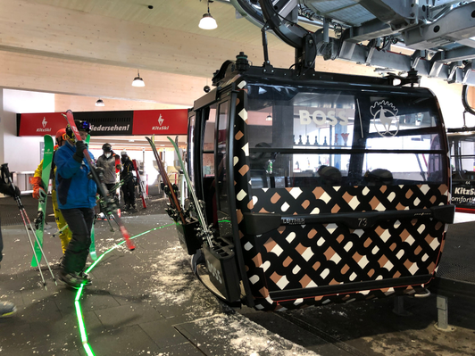Eye-catching gondola branding from BOSS in the KitzSki ski resort in Kitzbühel, Austria