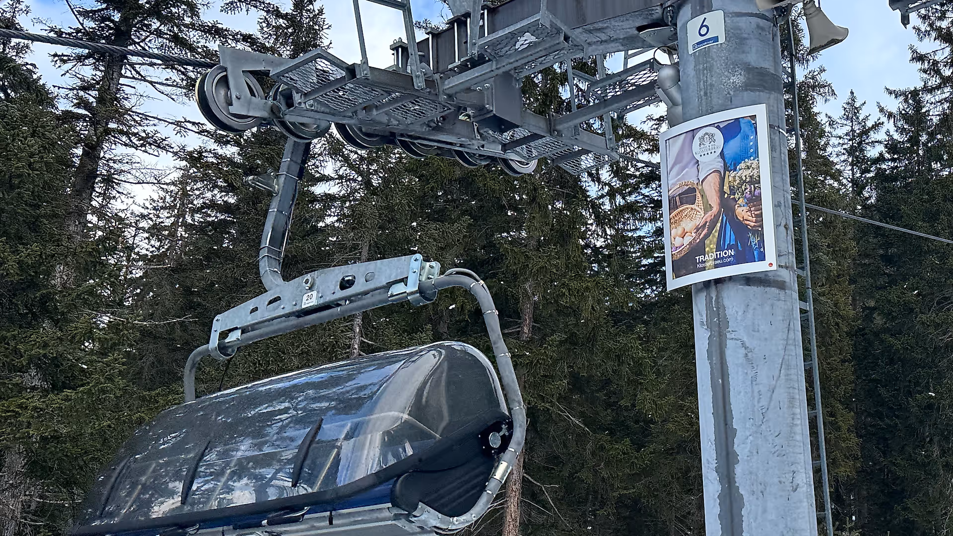 Romantic Dining OOH campaign by Hotel Klosterbräu on lift tower in Seefeld ski area