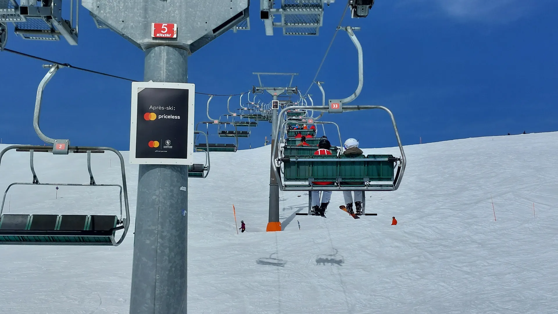 Ski lift pylon advertising with Mastercard motif in the KitzSki ski area in Kitzbühel, Austria