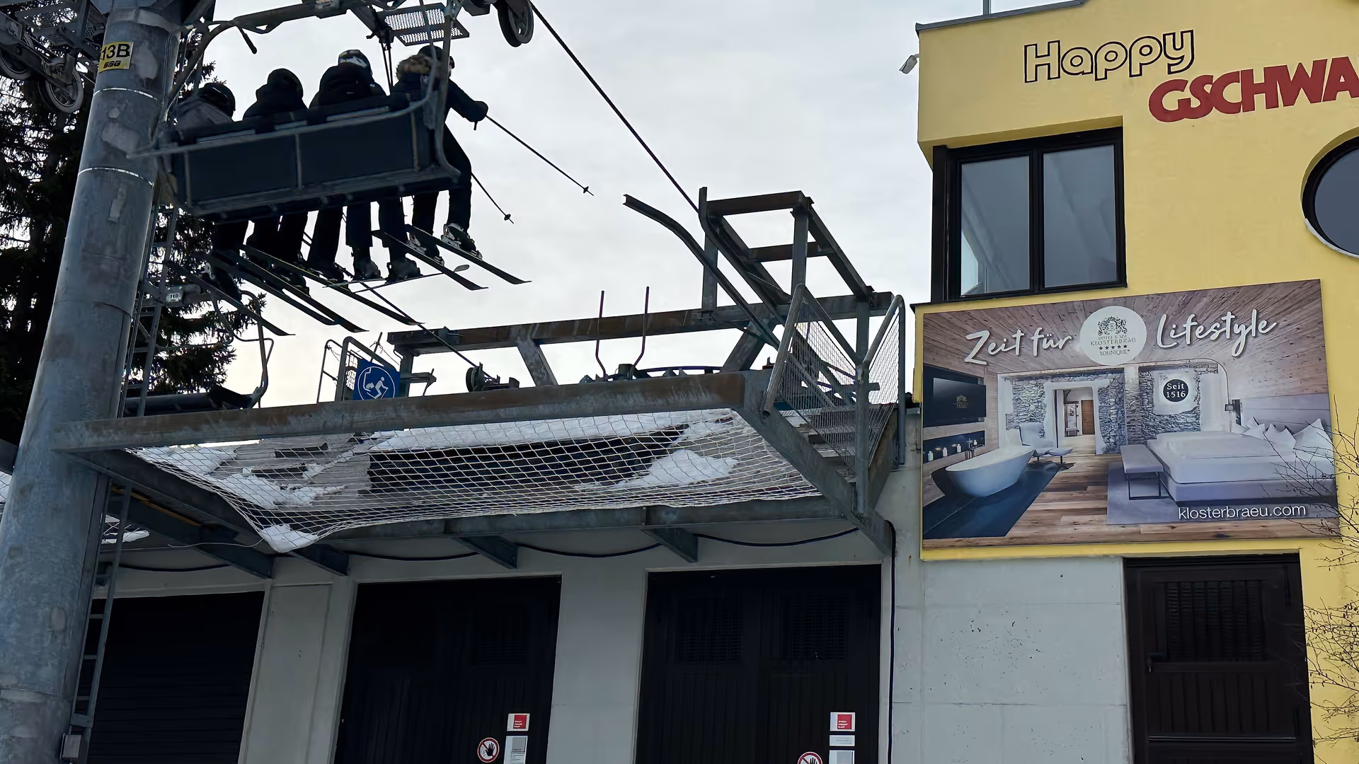 Prime-position SPA megaboard by Hotel Klosterbräu on lift tower at Seefeld mountain station